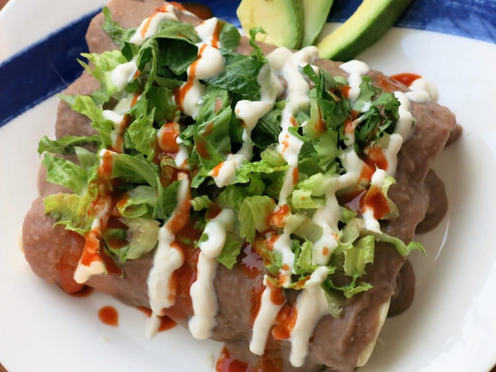 Enfrijoladas Potato Stuffed Tortillas in Bean Sauce Center for