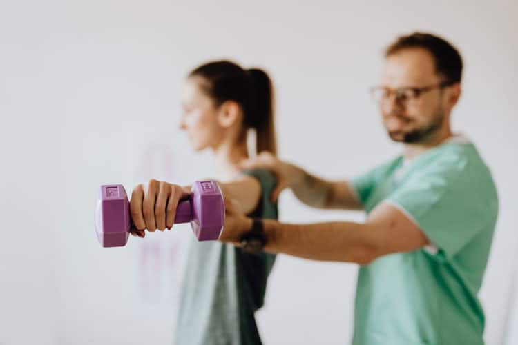 Chiropractor examining patient