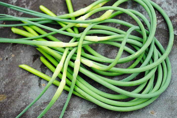 Chef Del’s Secret Garden Gems: Garlic Scapes, Carrot Tops, & Beet Greens