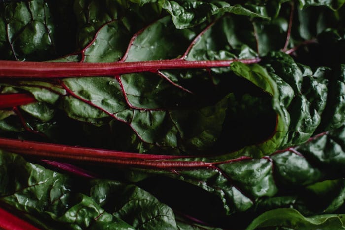 Chef Del’s Secret Garden Gems: Garlic Scapes, Carrot Tops, & Beet Greens